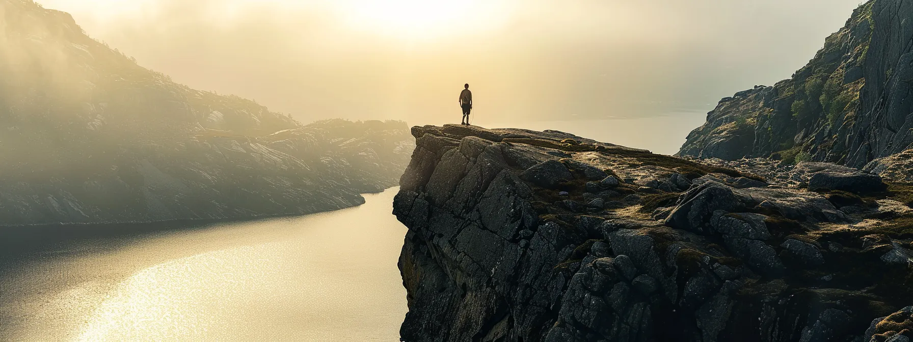 a person standing at the edge of a cliff, contemplating the possibilities below.